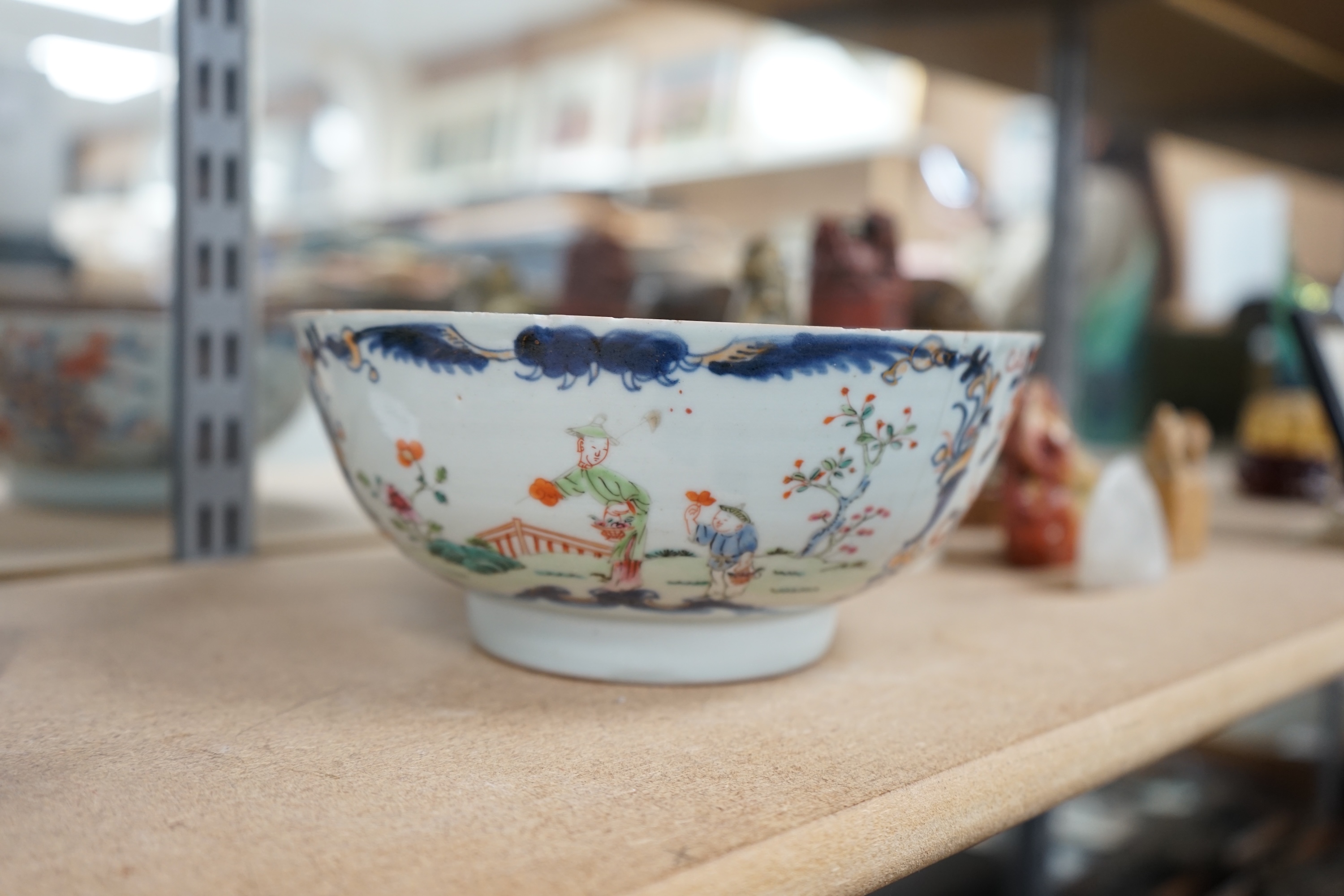 Five Chinese soapstone seals, a bronze figure of a Shou Lao, a pottery dog, a carved soapstone monkey and a Chinese famille rose bowl, 18th century, tallest 15cm high. Condition - poor to good